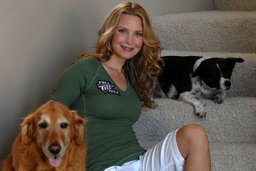 Erica Schoenberg (blackjack babe) sitting with dogs